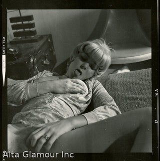 BLONDE ON BED WITH BOOKS -- PROOF SHEETS